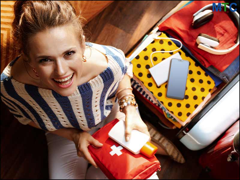 A lady packing medicines for her flight