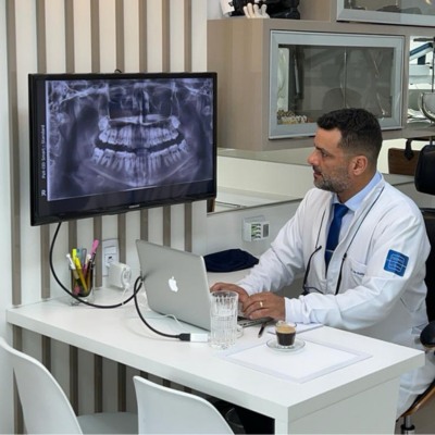 Dr. Luis Gustavo Checking the Dental Xrays