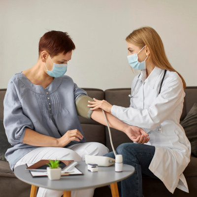 A doctor checking a patient's blood pressure