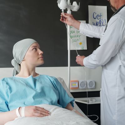 Cancer Patient assissted by doctor