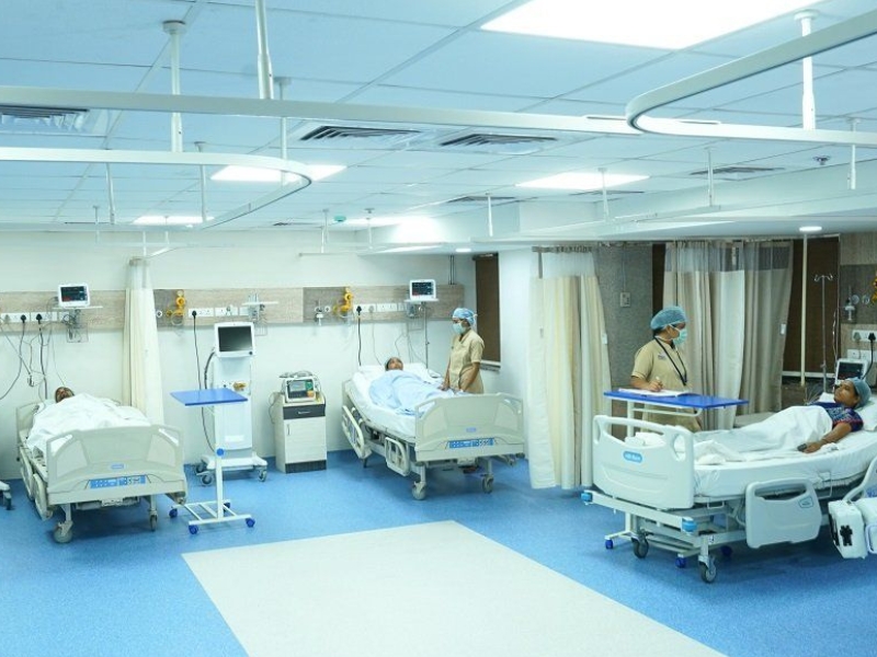 Nurses providing care to patients in a critical care unit