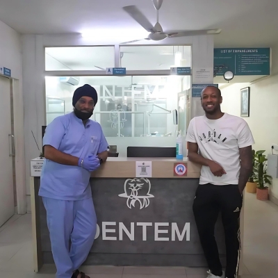 Dentem Dr. Singh with patient at the reception area