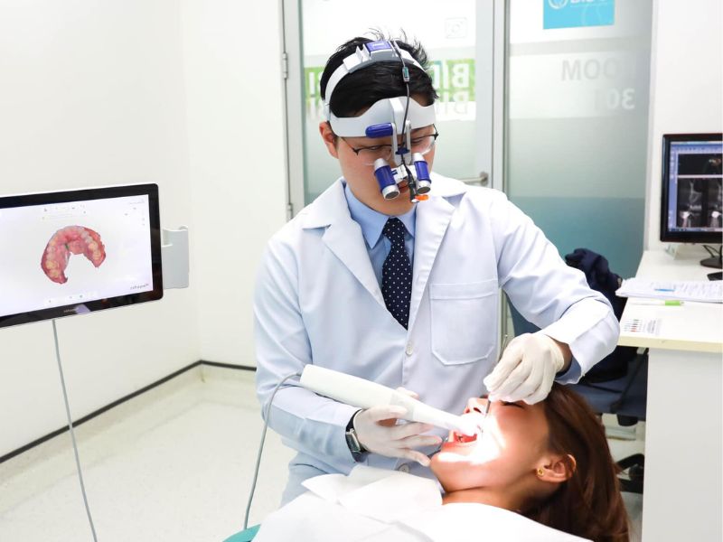 Dentist performing a thorough dental examination on a patient in a clinic setting