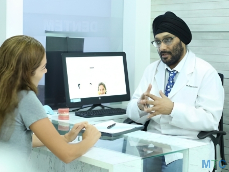 Dr. Tanvir Singh Explaining Treatment Plan to a Patient