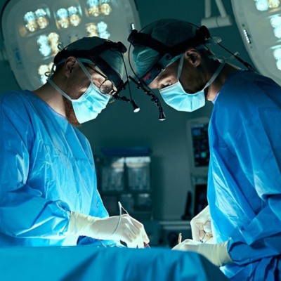 Surgeons Operating Patient in Operating Room