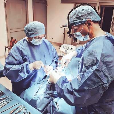 Surgeons performing Rhinoplasty on Patient