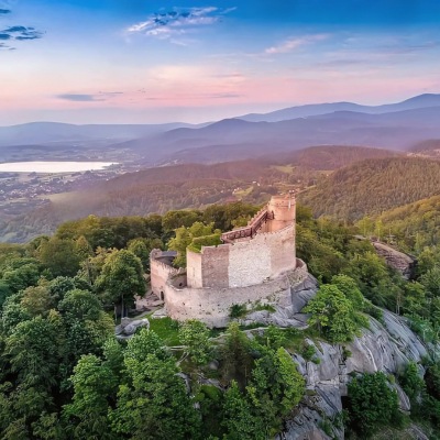 Chojnik Castle, Poland surrounded with mountains and green trees