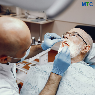 A dentist examining the patient